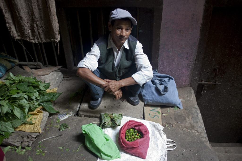 Farmer selling Dolle chillies, a specialty Sikkim is known for. Singtham market.